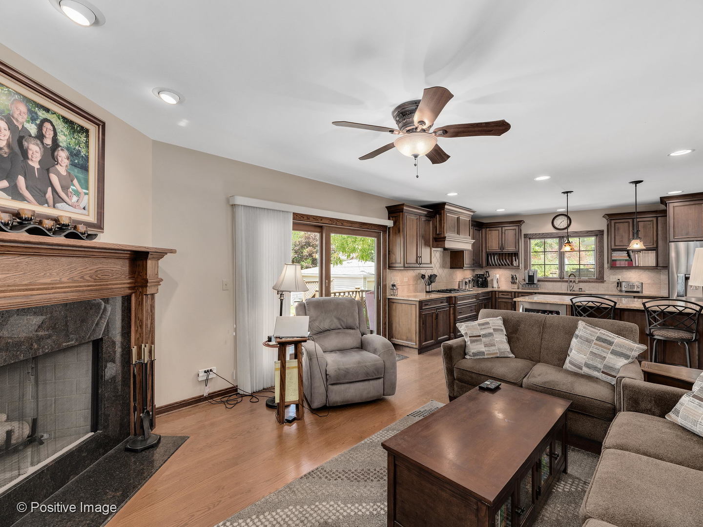 276 Blackhawk Road Riverside, IL 60546 - Photo 9 of 18 a living room with furniture a fireplace and a flat screen tv