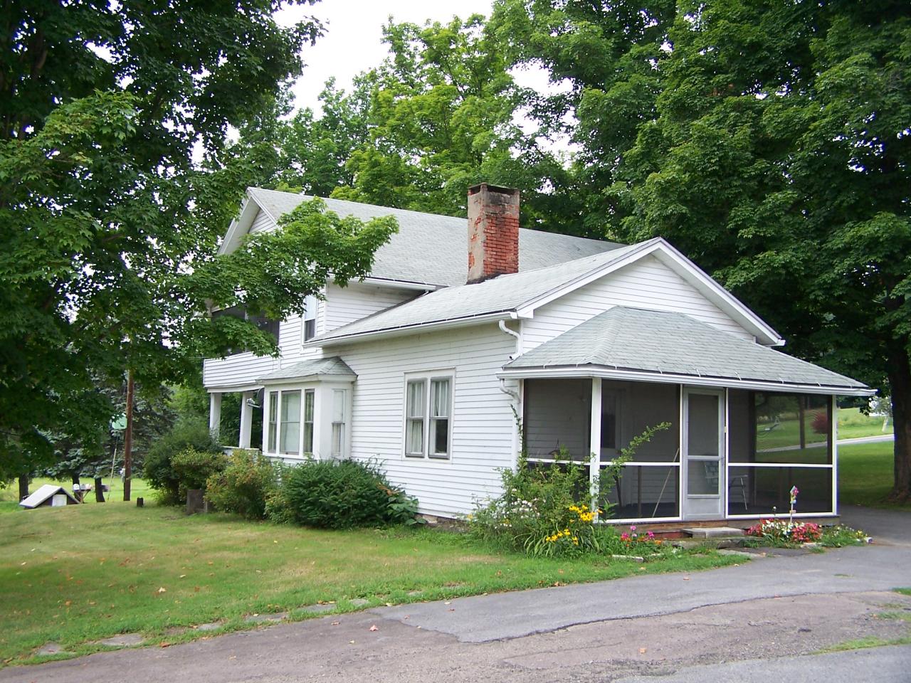 262 Demunds Road Dallas, PA 18612 - Photo 2 of 5 a front view of a house with a garden and yard