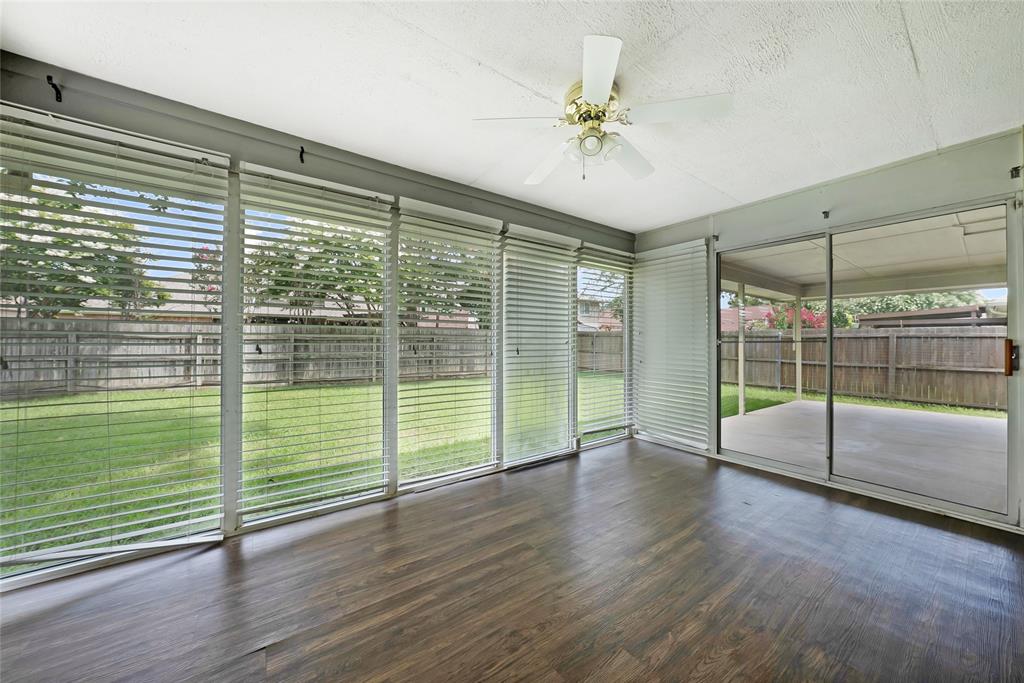 2910 Chisholm Trail Corinth, TX 76210 - Photo 25 of 30 a view of a room with wooden floor and windows