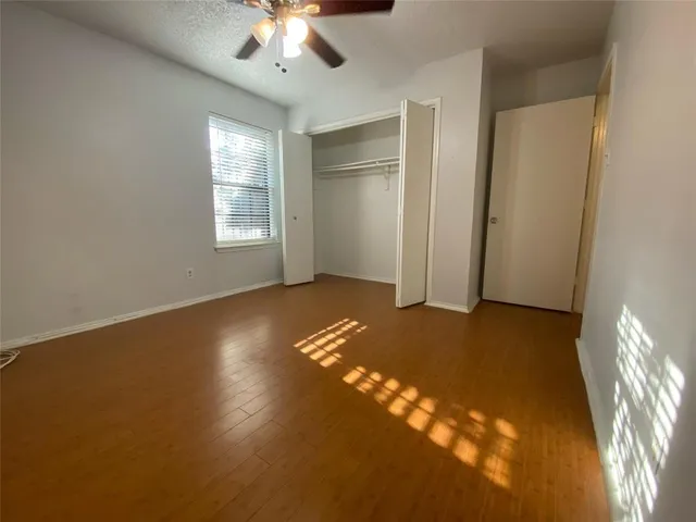 a view of house with backyard