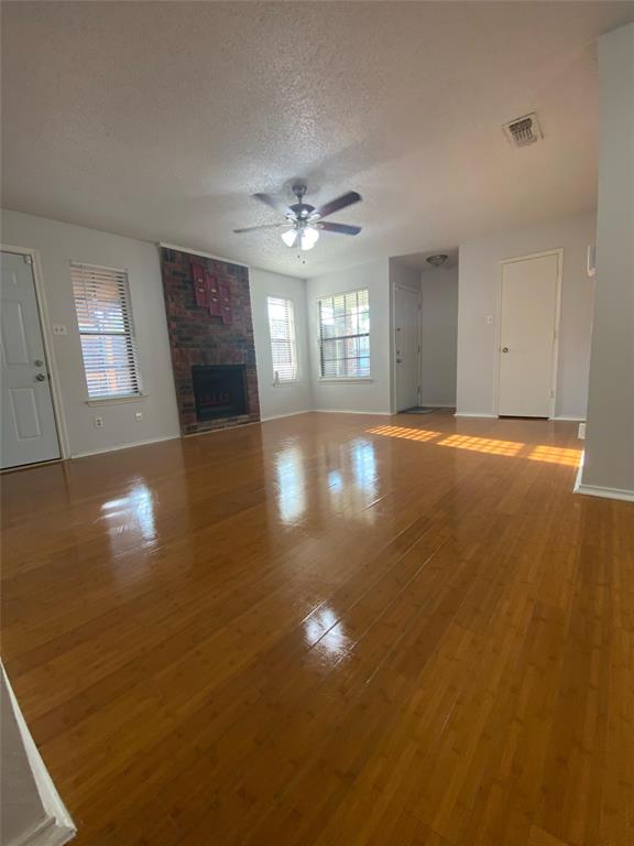 2022 Minnie Drive Arlington, TX 76012 - Photo 7 of 27 a view of empty room with wooden floor and fan