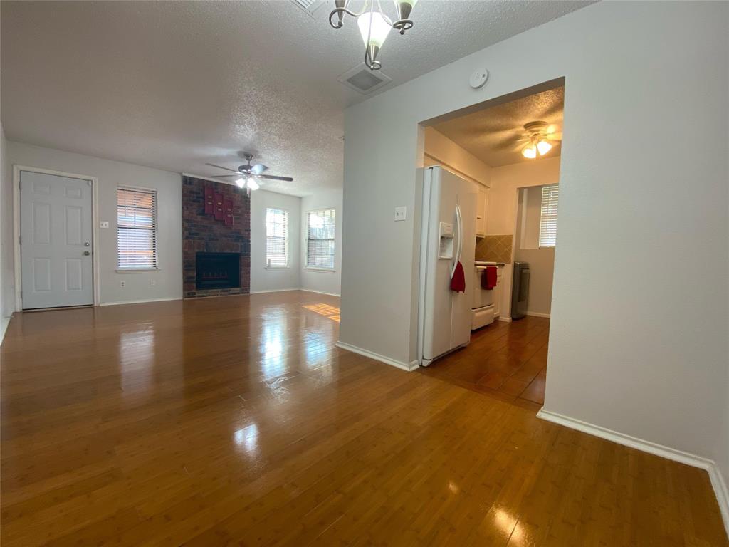 2022 Minnie Drive Arlington, TX 76012 - Photo 8 of 27 a view of a hallway with wooden floor