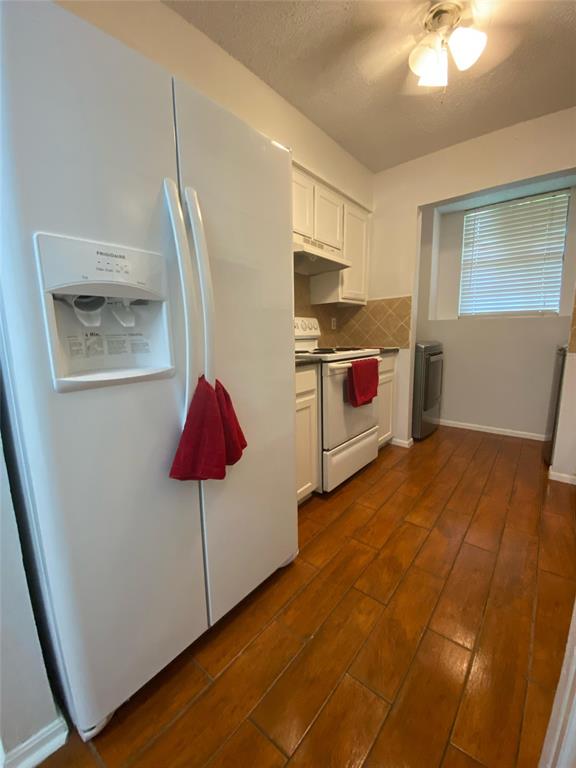 2022 Minnie Drive Arlington, TX 76012 - Photo 10 of 27 a kitchen with stainless steel appliances granite countertop a sink a stove top oven a counter space and cabinets