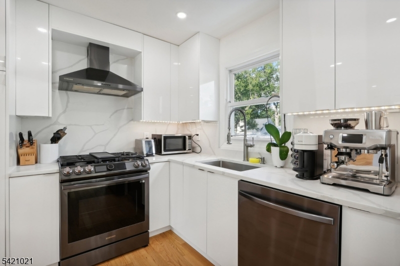 821 Hillside Road Rahway, NJ 07065 - Photo 11 of 33 a kitchen with stainless steel appliances a stove a sink and a counter space