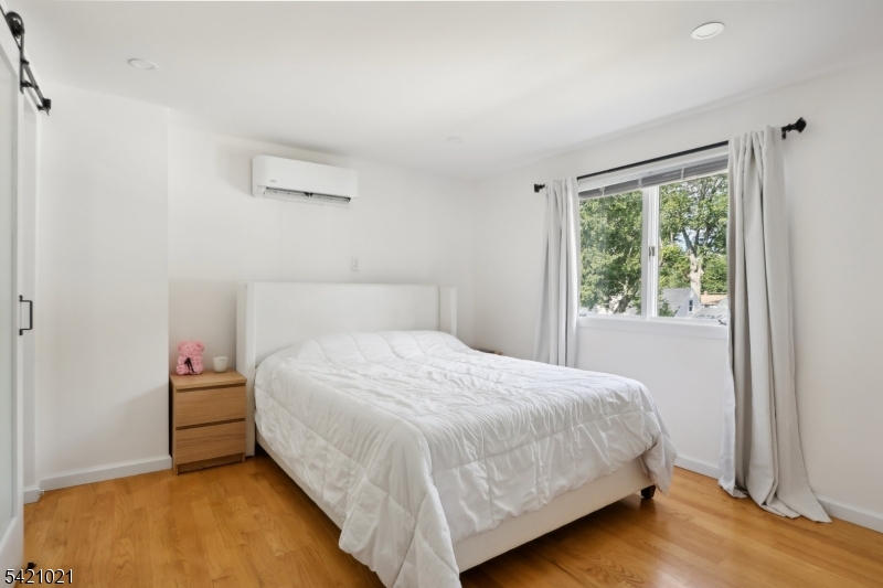 821 Hillside Road Rahway, NJ 07065 - Photo 15 of 33 a bedroom with a bed and a window