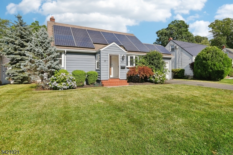 821 Hillside Road Rahway, NJ 07065 - Photo 2 of 33 a front view of a house with a garden and plants