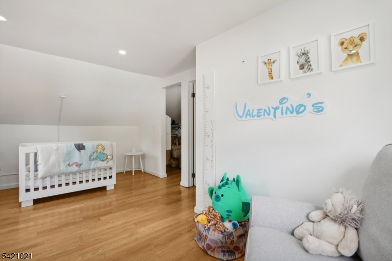 821 Hillside Road Rahway, NJ 07065 - Photo 22 of 33 a bedroom with furniture and a potted plant