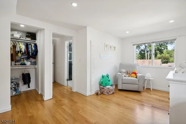 a view of a livingroom with kitchen and dining room