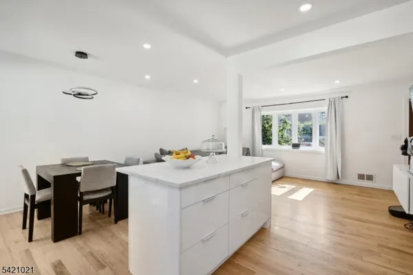 a view of kitchen with wooden floor and window