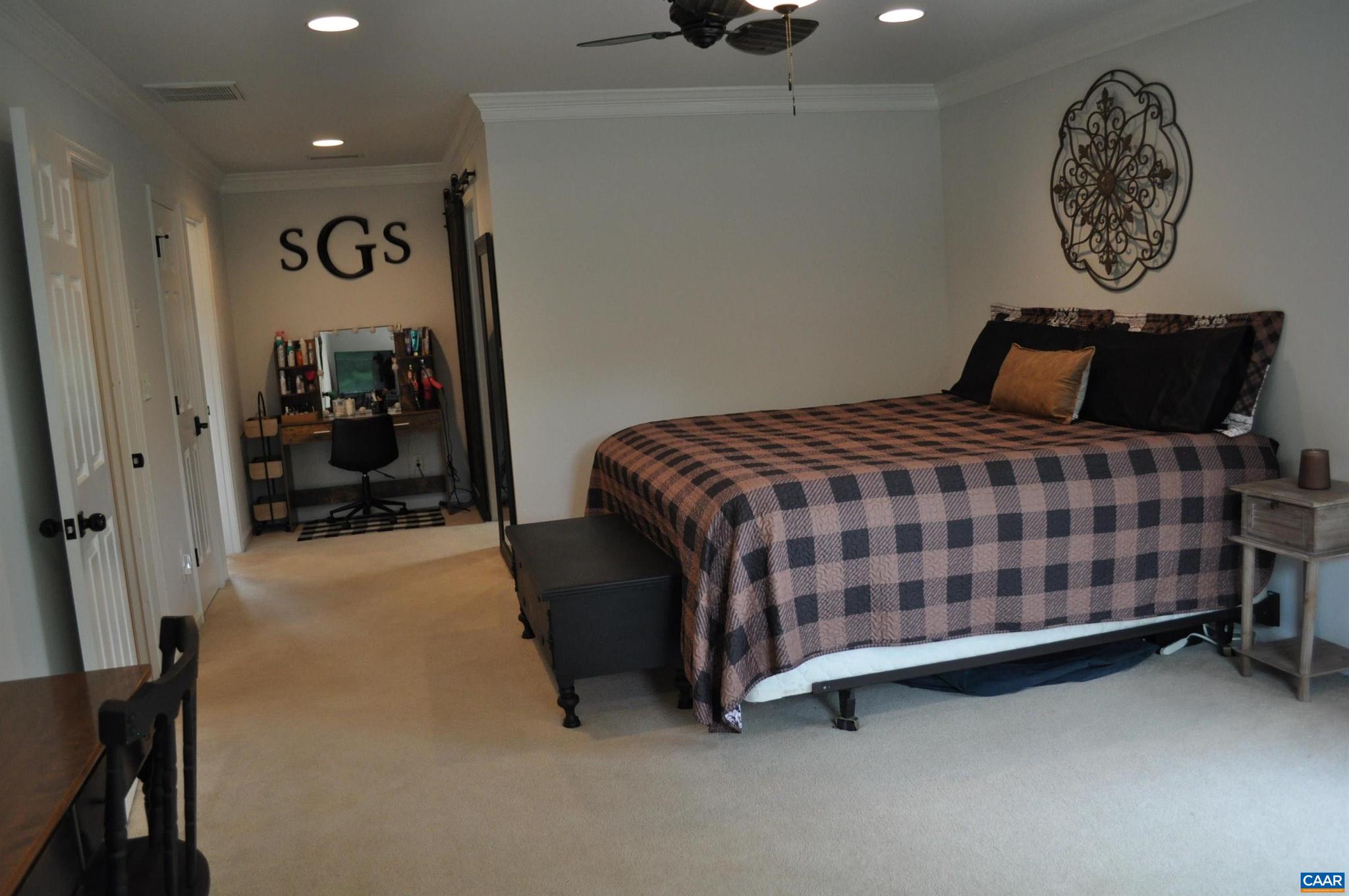 3257 Martin Kings Road Charlottesville, VA 22902 - Photo 23 of 49 a bedroom with a bed and painting on the wall