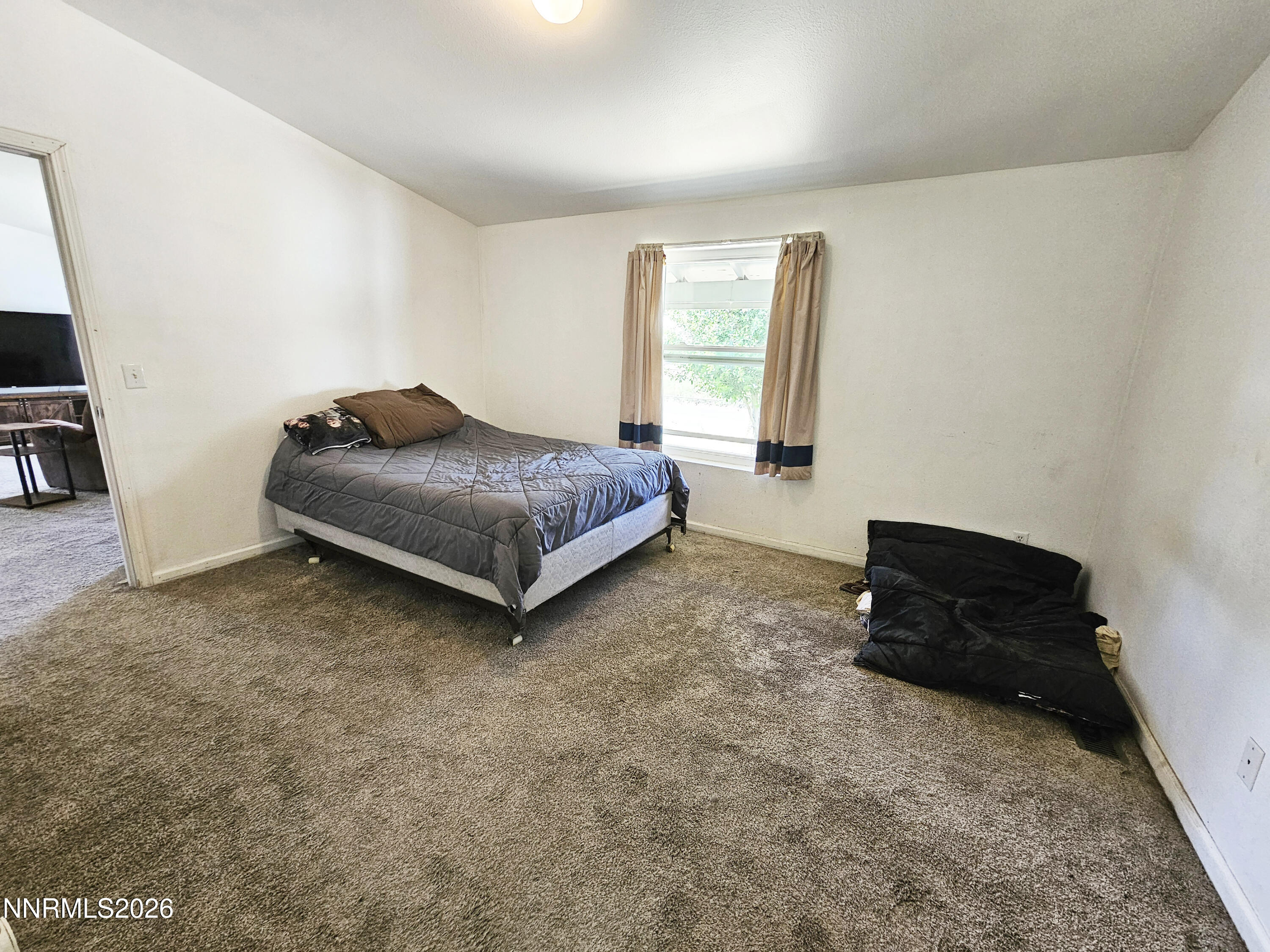 1125 Rancho Road Fernley, NV 89408 - Photo 17 of 47 a living room with furniture and a window