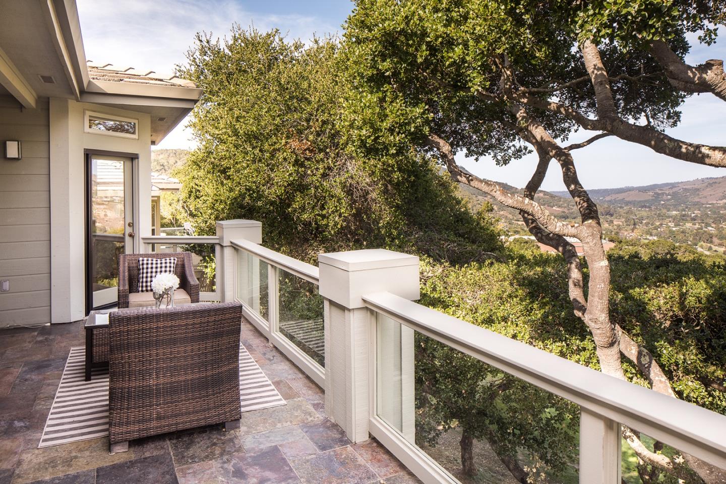 10439 Fairway Lane Carmel, CA 93923 - Photo 15 of 22 a view of a balcony with wooden chairs and fence