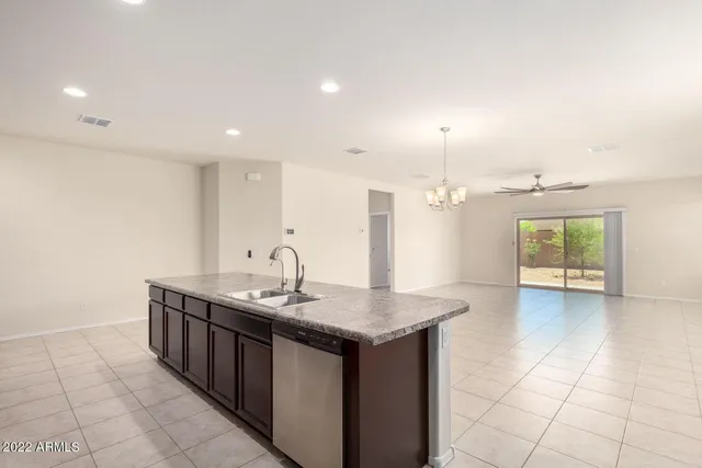 a kitchen with a sink and a stove