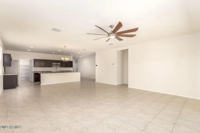 a view of a kitchen with a sink and a stove top oven