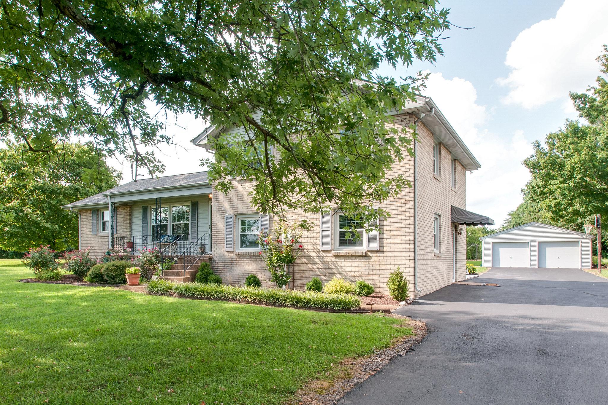 9576 Mullens Road Arrington, TN 37014 - Photo 2 of 26 a front view of house with yard and green space