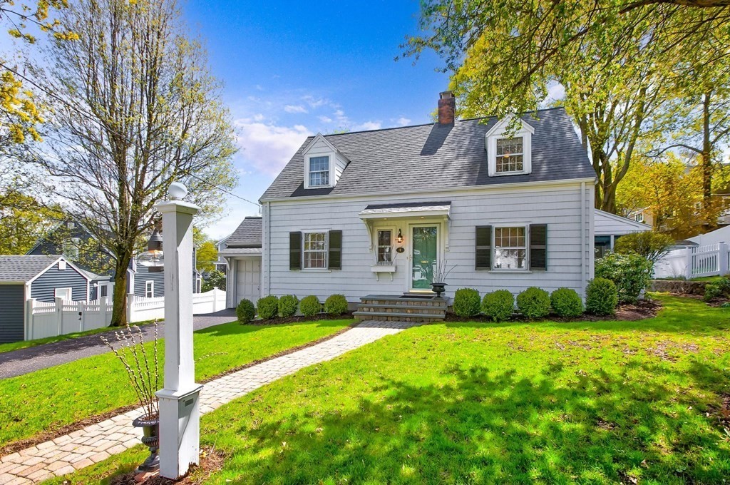4 Pine Hill Circle Wakefield, MA 01880 - Photo 1 of 41 a front view of a house with a yard and trees