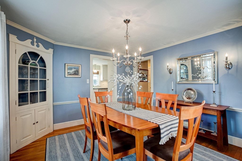 4 Pine Hill Circle Wakefield, MA 01880 - Photo 12 of 41 a view of a dining room with furniture a chandelier and wooden floor