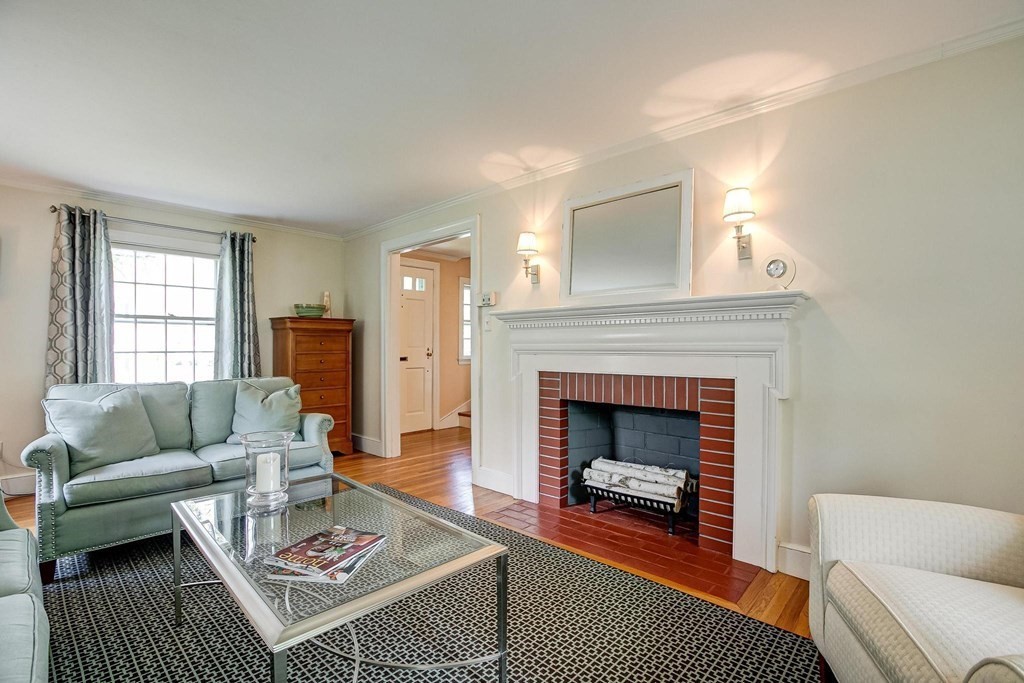 4 Pine Hill Circle Wakefield, MA 01880 - Photo 13 of 41 a living room with furniture and a fireplace