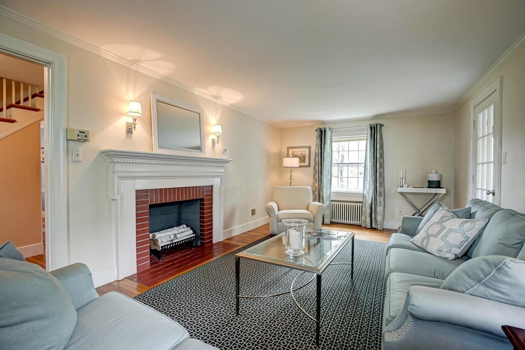 4 Pine Hill Circle Wakefield, MA 01880 - Photo 15 of 41 a living room with furniture and a fireplace