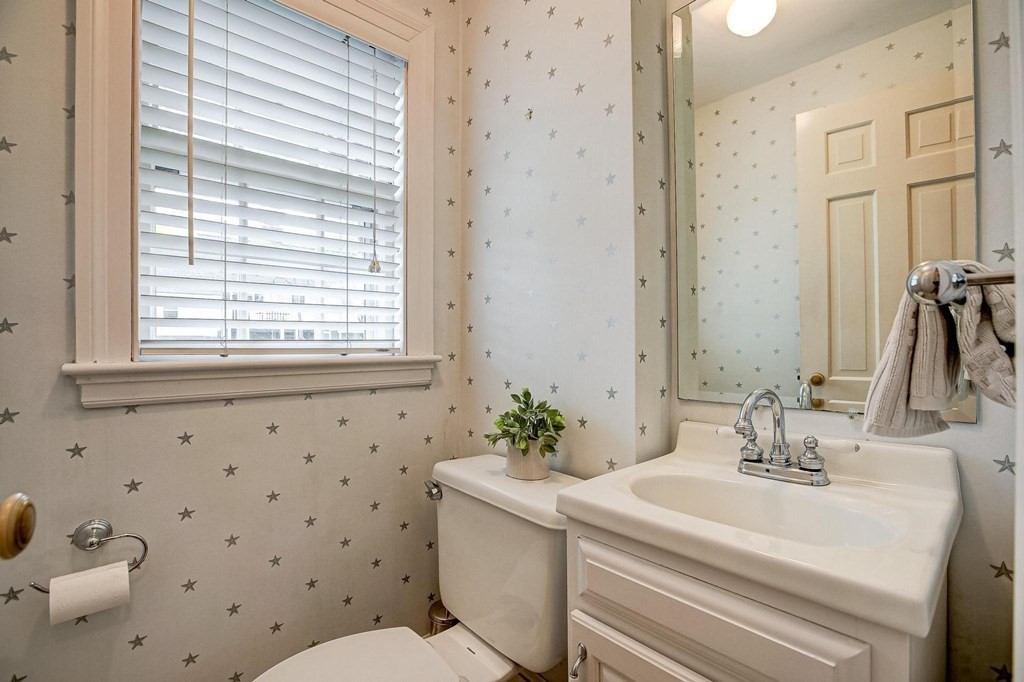 4 Pine Hill Circle Wakefield, MA 01880 - Photo 17 of 41 a bathroom with a sink a toilet and a mirror