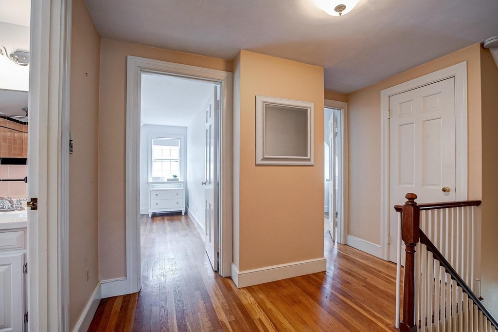 4 Pine Hill Circle Wakefield, MA 01880 - Photo 19 of 41 a view of a hallway with wooden floor