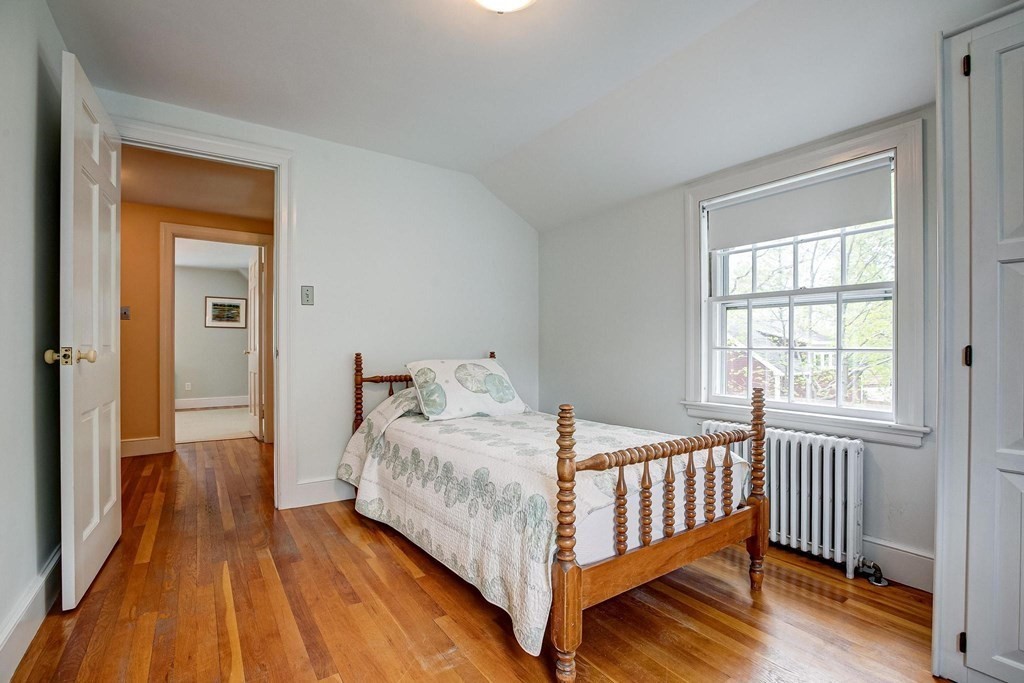 4 Pine Hill Circle Wakefield, MA 01880 - Photo 23 of 41 a bedroom with a bed and wooden floor