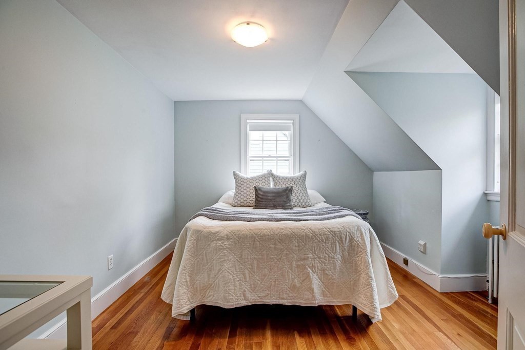 4 Pine Hill Circle Wakefield, MA 01880 - Photo 25 of 41 a bedroom with a bed and wooden floor