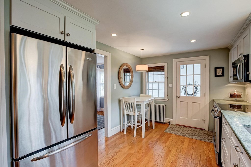 4 Pine Hill Circle Wakefield, MA 01880 - Photo 8 of 41 a view of a kitchen with furniture and a wooden floor
