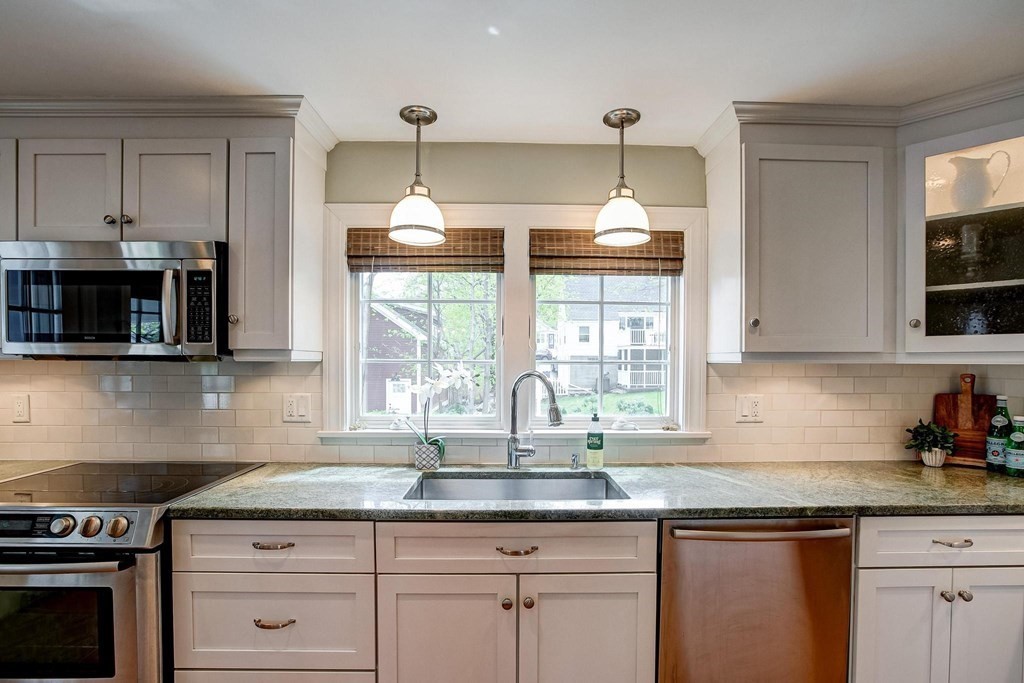 4 Pine Hill Circle Wakefield, MA 01880 - Photo 9 of 41 a kitchen with granite countertop a stove a sink and a granite counter tops