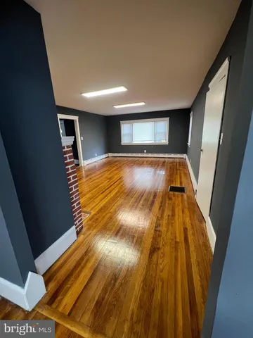 a view of a livingroom with furniture and a flat screen tv