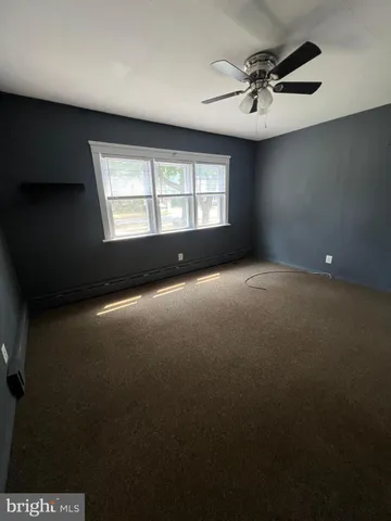 an empty room with a empty space and a window