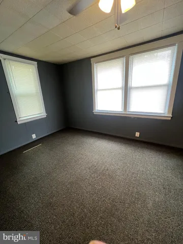 a living room with couches and furniture