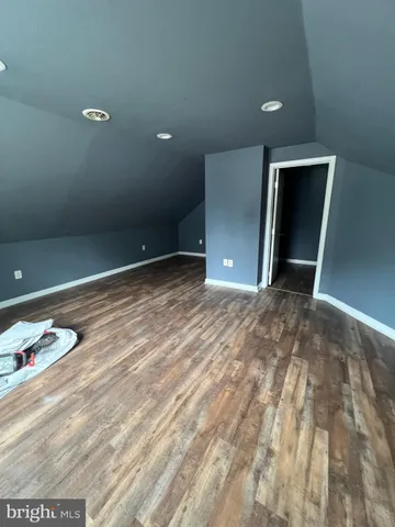 a bathroom with a toilet and a mirror