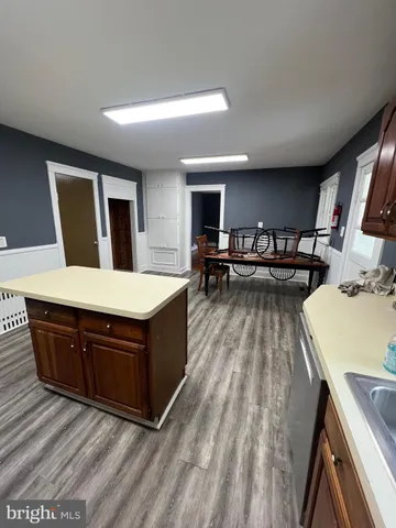 a view of an empty room and a window