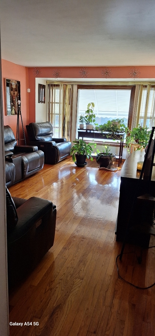 9351 South Normal Avenue Chicago, IL 60620 - Photo 5 of 14 a living room with furniture and a large window