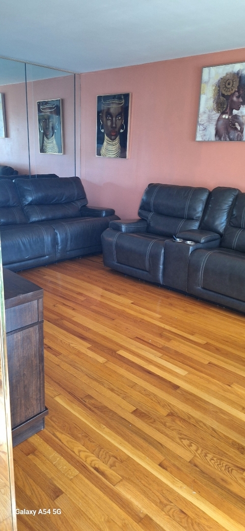 9351 South Normal Avenue Chicago, IL 60620 - Photo 6 of 14 a view of a room with furniture and wooden floor