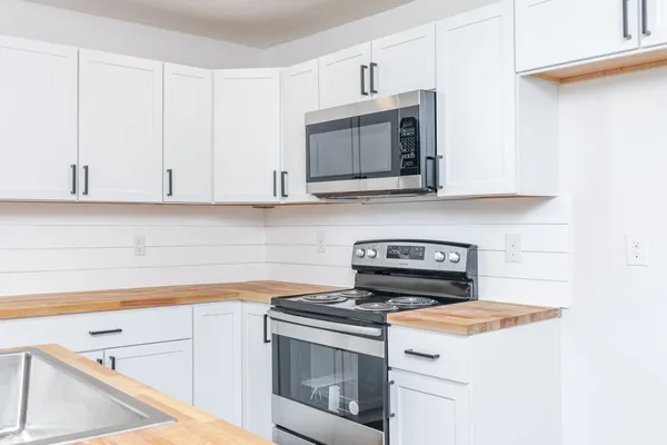 a kitchen with a stove and a microwave