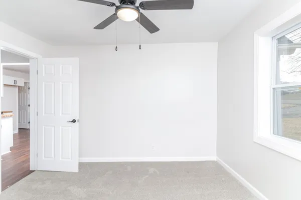 an empty room with fan