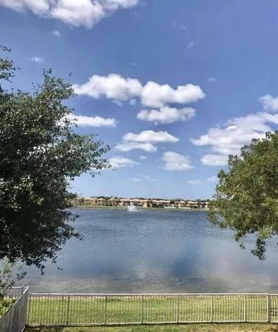 a view of a lake and a yard
