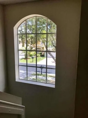 a view of an empty room with a window