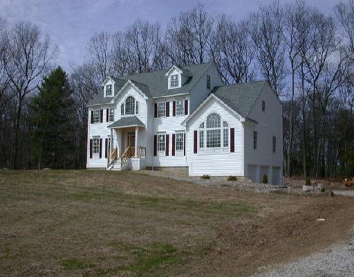 17 Misty Vale Road Newtown, CT 06482 - Photo 1 of 1 a front view of a house with a garden