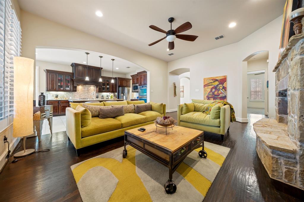 2114 Spicewood Drive Allen, TX 75013 - Photo 14 of 37 a living room with furniture kitchen view and a chandelier