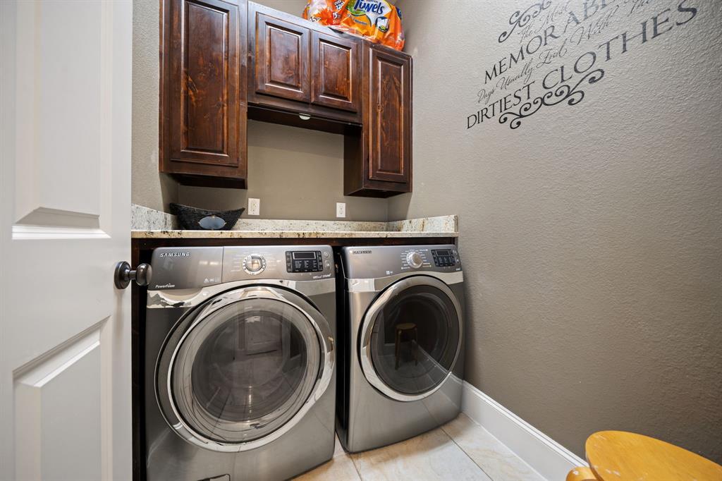2114 Spicewood Drive Allen, TX 75013 - Photo 16 of 37 a utility room with dryer and washer