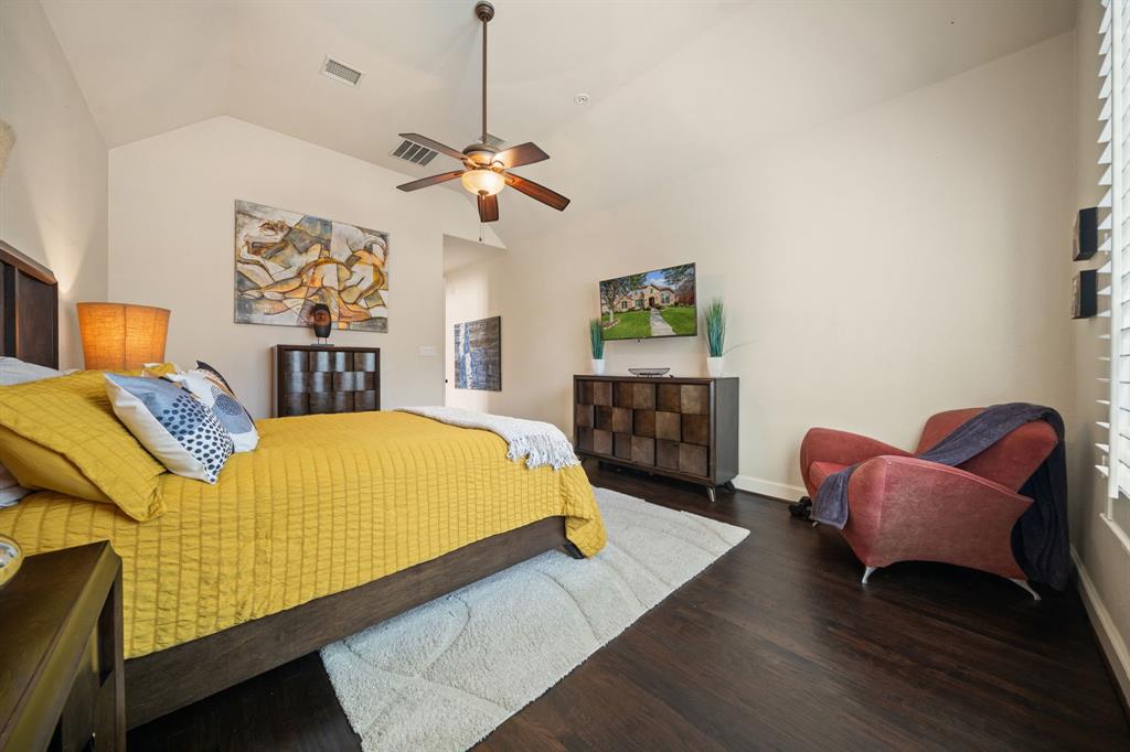 2114 Spicewood Drive Allen, TX 75013 - Photo 18 of 37 a bed room with a bed and a chair