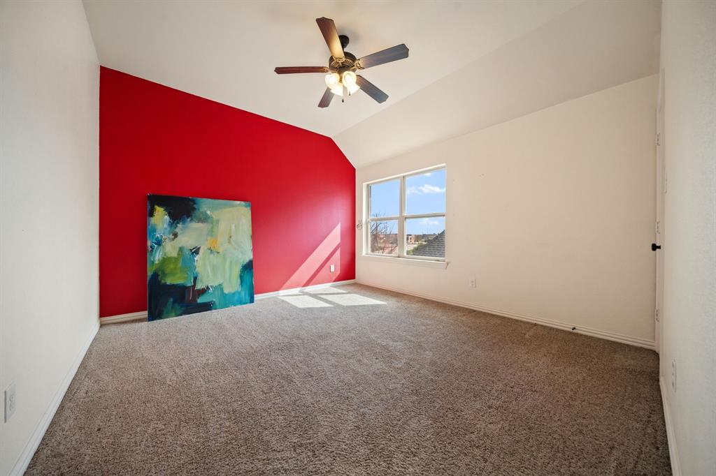 2114 Spicewood Drive Allen, TX 75013 - Photo 25 of 37 a view of a living room with a ceiling fan and a rug