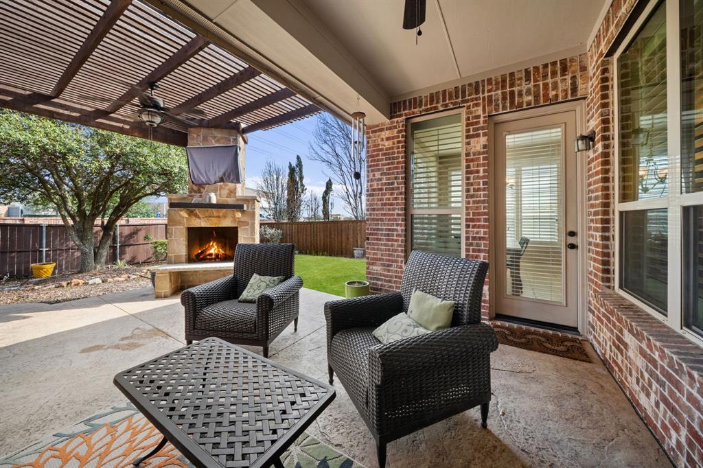 2114 Spicewood Drive Allen, TX 75013 - Photo 32 of 37 a outdoor living space with furniture and a fireplace