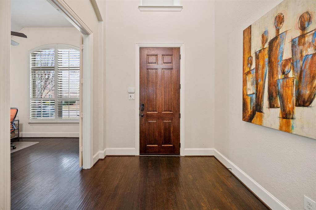 2114 Spicewood Drive Allen, TX 75013 - Photo 5 of 37 an empty room with wooden floor and windows