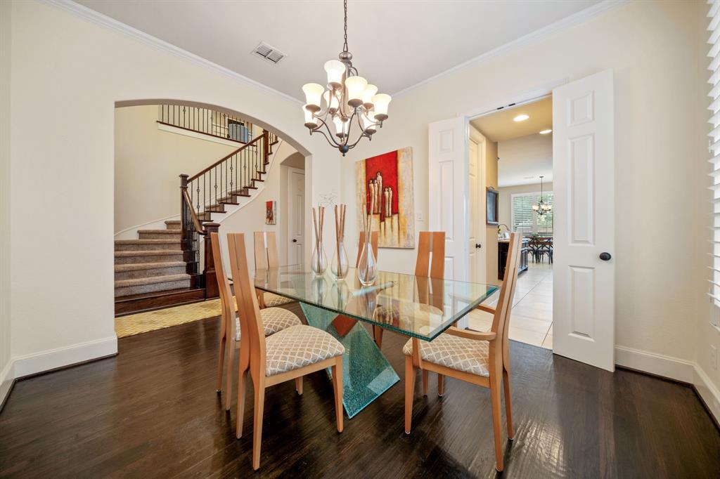 2114 Spicewood Drive Allen, TX 75013 - Photo 8 of 37 a view of a room with wooden floor staircase and windows