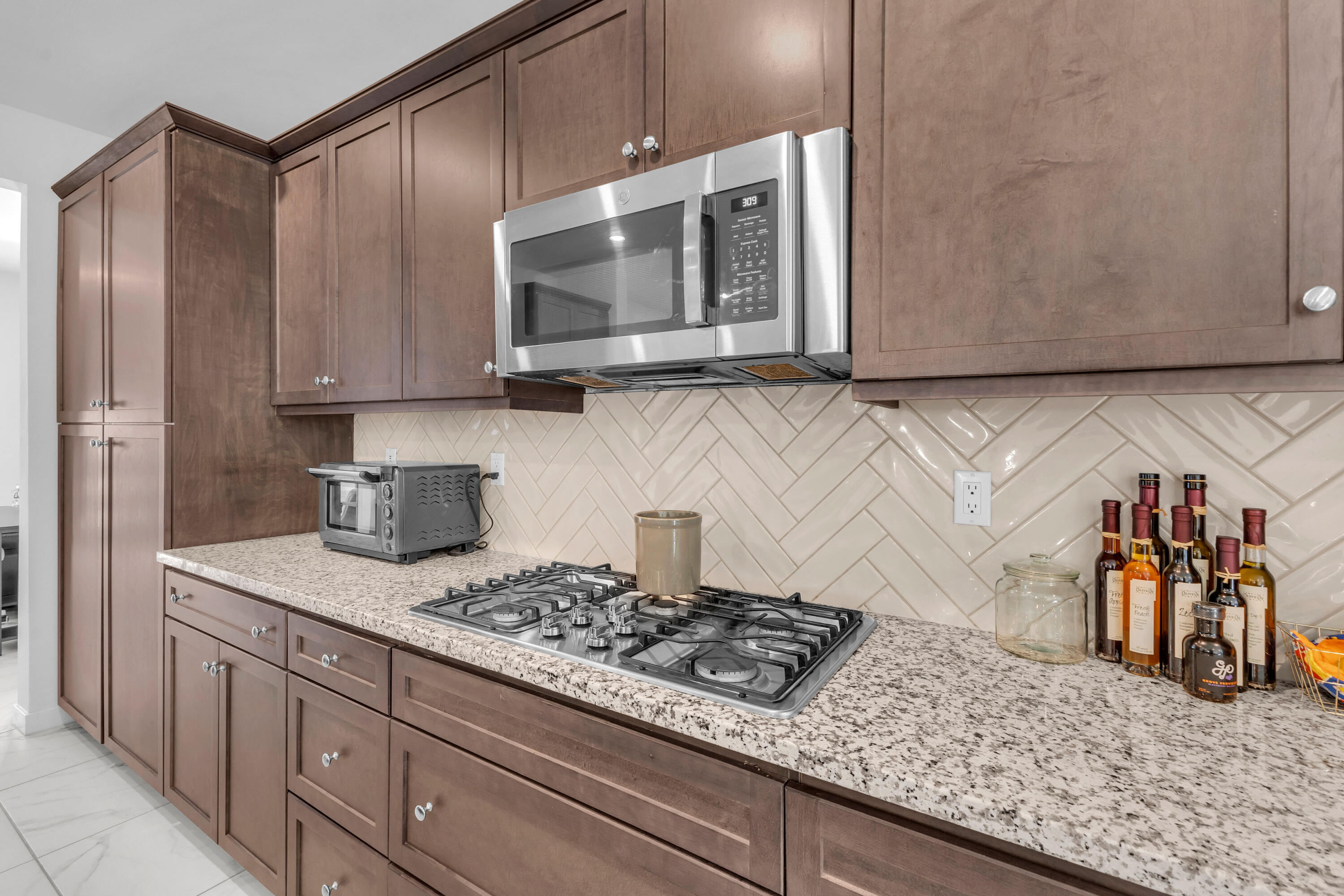 39763 Majorca Drive South Indio, CA 92203 - Photo 15 of 57 a kitchen with stainless steel appliances granite countertop a sink and a microwave