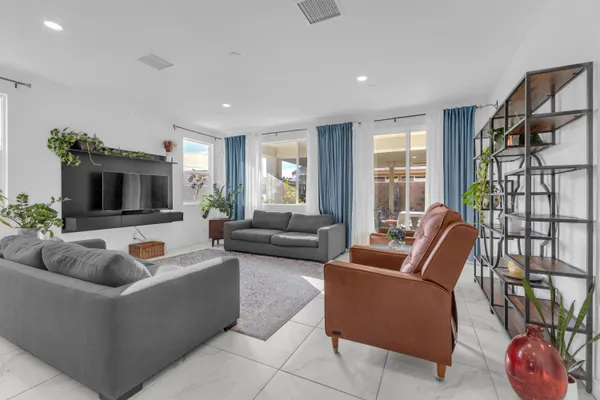 a living room with furniture and a couch
